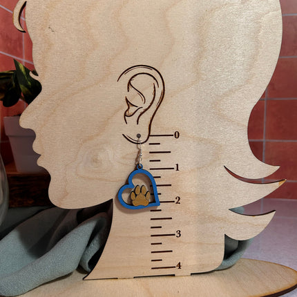 Blue paw heart earring shown on wood earring size chart displaying approximately 2 inch drop length