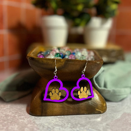 Pair of purple hand-painted birchwood heart earrings with gold paw print, sterling silver fishhook wires