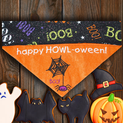 A festive orange dog bandana with 'Happy Howl-oween!' text and Halloween-themed decorations like bats and pumpkins.